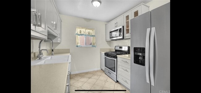 Remodeled kitchen - 12828 Ramona Blvd Condo Unit 44