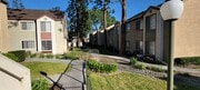 Walkway between building complexes at Northwood Apartments in Upland, California. - Northwood Apartments