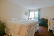 Hardwood floor in bedroom - 3106 Summertime Ln Condo Unit 106
