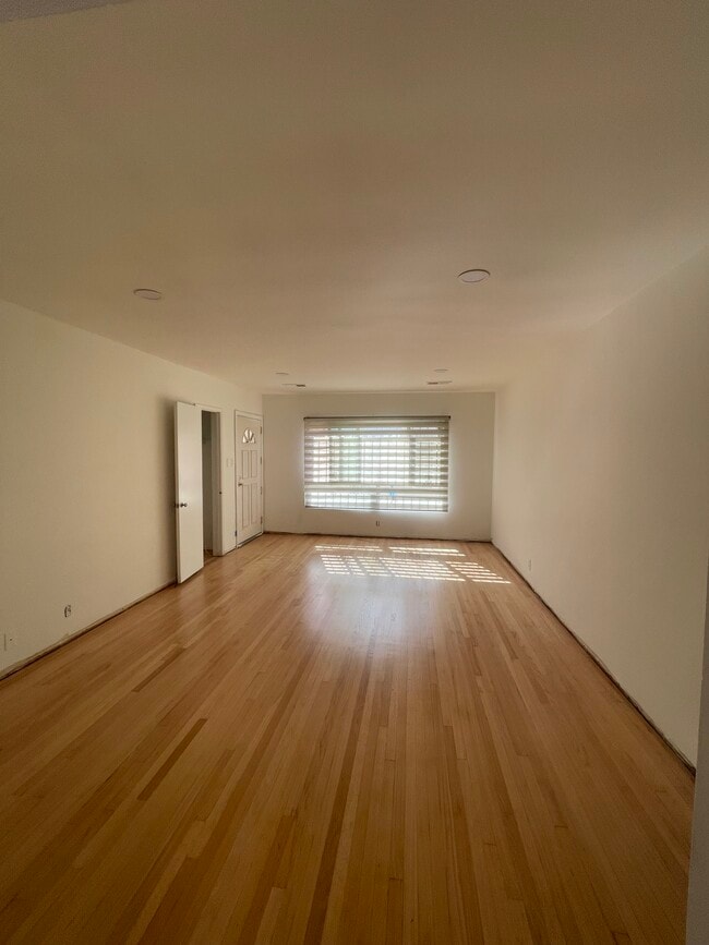 Large living room with solid oak hardwood and recess lighting - 10513 Crenshaw Blvd Unit 10513 Crenshaw Blvd #1