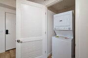 Enjoy the ultimate everyday convenience of a modern in-unit stacked washer and dryer. - textur Apartments