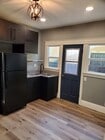 Kitchen with side door to semi-private area on side of property - 579 W. 13th St Townhome