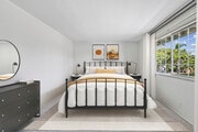 Bedroom with carpet - AVA Newport Apartments