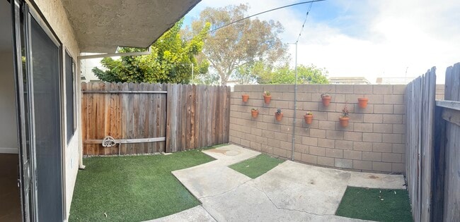 Private back yard/patio with string lights - 16622 Jib Cir Unit #2