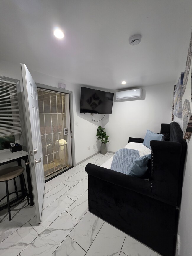 Living room - 124 E 135th St Unit Back