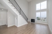 1BR + Loft, 1BA - 715SF - Living Room - The Norman
