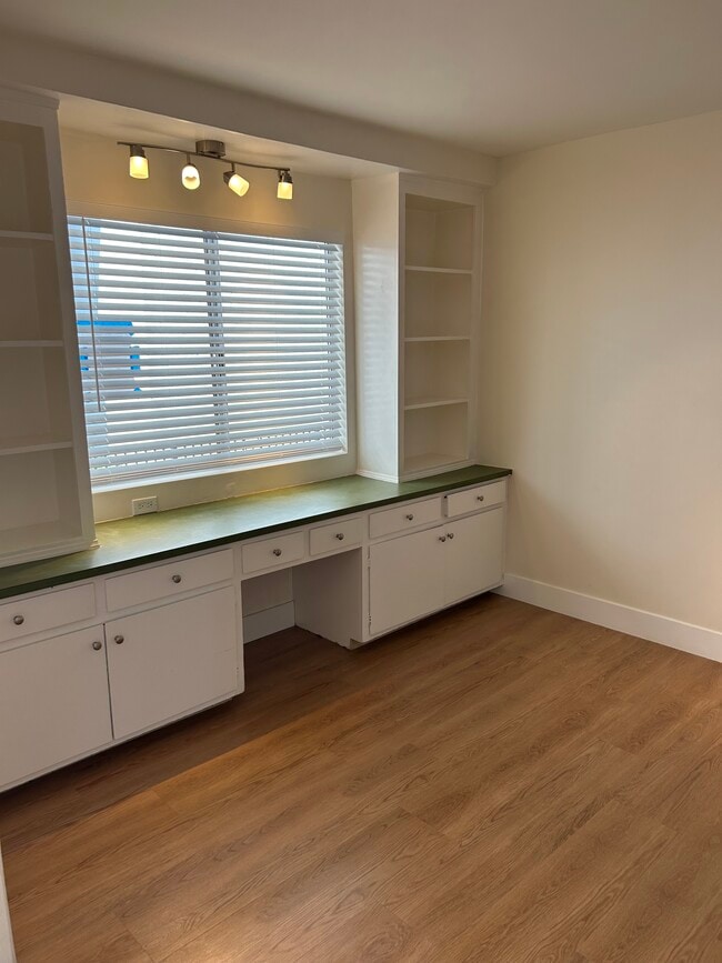 Den with large window and built in cabinets. - 1137 12th St Unit #9. 2 bedroom plus den