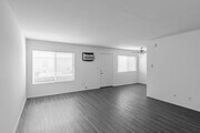 2BR, 1.5BA - 940SF - Living Room - The Bungalows Apartments