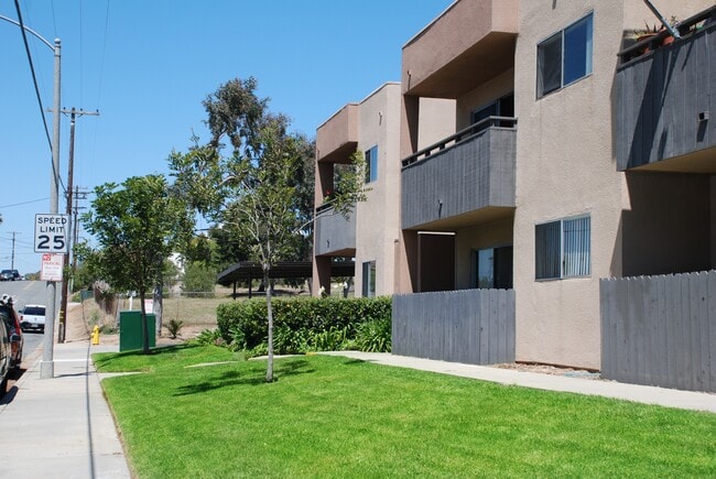 Lawns and gardens in front of Villa Pacific Apartments in Oceanside, California. - Villa Pacific Apartments