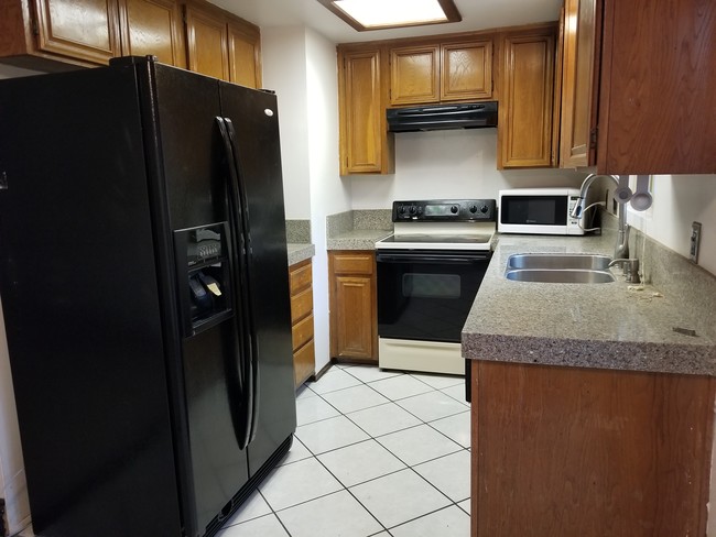 Kitchen with Granite Counters - 200 Elm Ave Unit #7