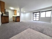 Living and dining area. Door to outside balcony. - 10982 Roebling Ave Unit 464