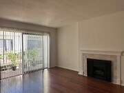 Living Room w/Balcony - 4370 Troost Ave Unit 202 Studio City