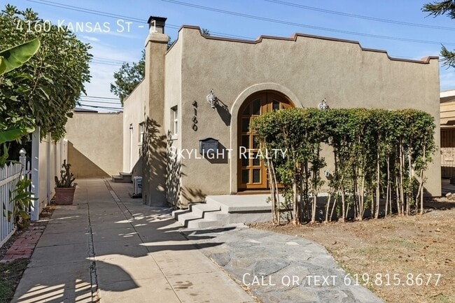 Building Photo - 4160 Kansas St Unit 1