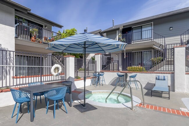 Relaxation redefined: Dive into luxury living at Independence Plaza, where every apartment boasts an updated patio overlooking our pool area and jacuzzi. Your perfect oasis awaits. - Independence Plaza Apartment Homes