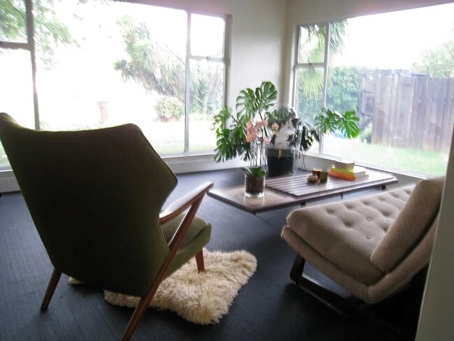living room with expansive windows in front of house - 4608 Nob Hill Dr