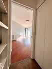 Secondary hallway w/ linen & laundry closets - 4201 Via Marisol Condo Unit 133
