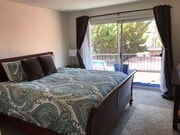 Photo - Beautiful Townhome with large fenced back patio, second story balcony, and two covered parking spots