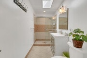 Large bathroom with shower, vanity - 32702 Seven Seas Dr House