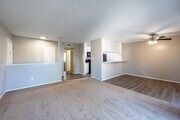 2BR, 1.5BA - 950SF - Living Room/Dining Room - VILLAGE GREEN
