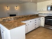 Kitchen with granite counters & bar seating - 533 N Helberta Ave
