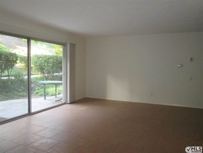 Building Photo - 5700 Baltimore Dr Unit 187