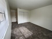 master bedroom with new carpet and closet and blinds and paint - 1225 N Broadway Townhome