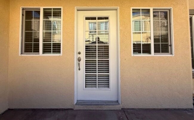 Building Photo - Upgraded Condo with Private Patio, AC, Pool, Gym, and Covered Parking in Gated Community