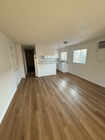 Living Room / Kitchen - 525 Jacmar Dr Apartments Unit B