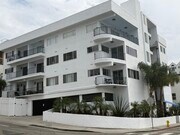 Exterior view of building from Seaside Terrace and garage entrance - 1649 Appian Way Unit #210