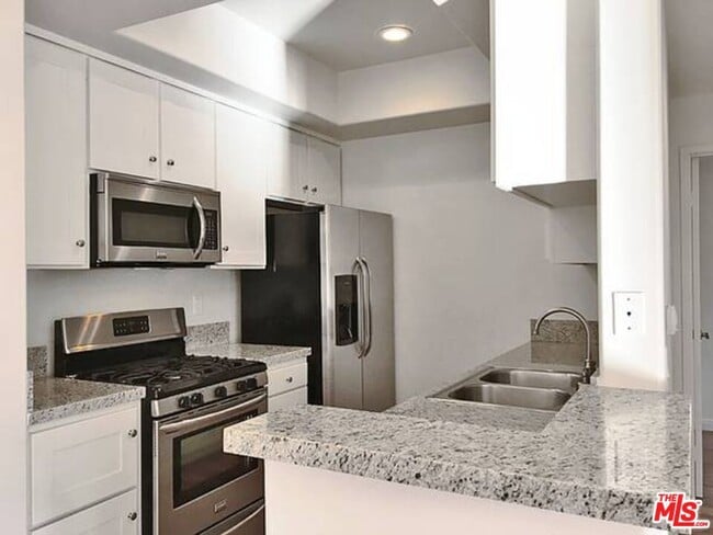 Building Photo - 14430 Benefit St Unit 201