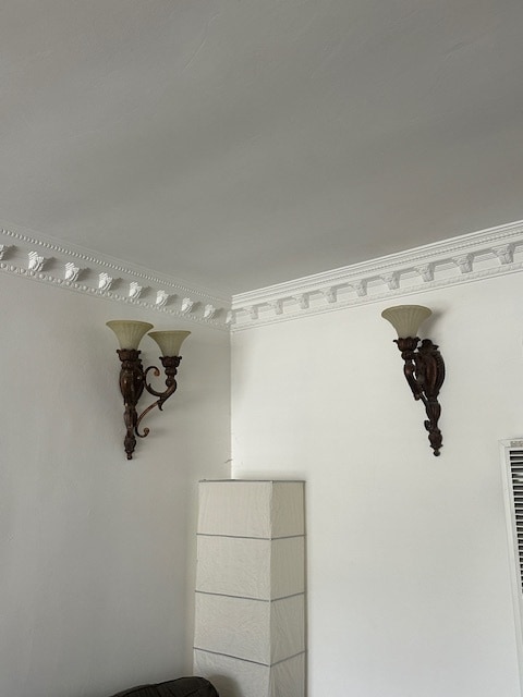 Living room wall sconces with beautiful crown molding. - 1859 1/2 Pandora Ave Unit 1
