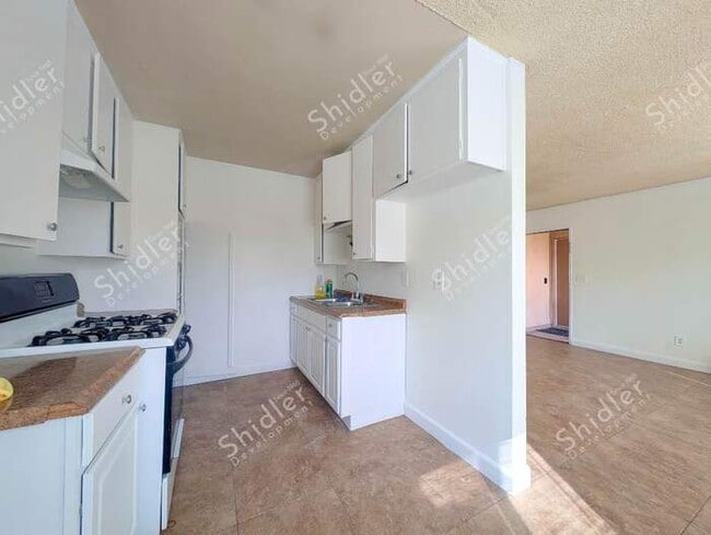 Photo - Upstairs 2 Bedroom 1 Bath with Massive Walk In Closet, Covered Gated Parking