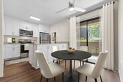 Renovated Package I kitchen and dining room with hard surface flooring - eaves South Coast