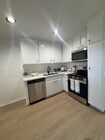 New Quartz Counter w/ Stainless Steel Appliances - Prairie Gardens Apartments