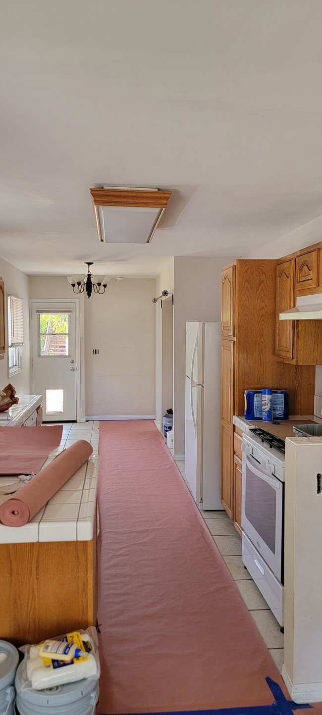 Kitchen with door to backyard - 1662 E Ocean Ave Unit 1662 Main House