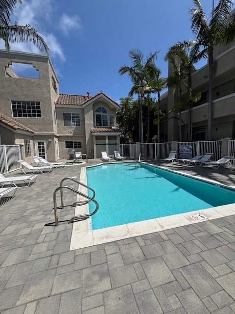 Community pool, jacuzzi and clubhouse - 4581 Warner Ave Condo Unit #102