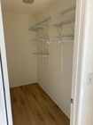 Large walk-in closet with built-in shelving - 8305 Summertime Ln Unit 8305