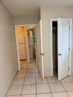 Inside bedroom looking into kitchen. Bedroom closet. - 17526 Horace St Unit Garage attached apartment