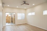 View of living room looking out to private patio - 4772 Bancroft St Townhome