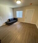 Living room - 1396 W 30th St Apartments Unit B