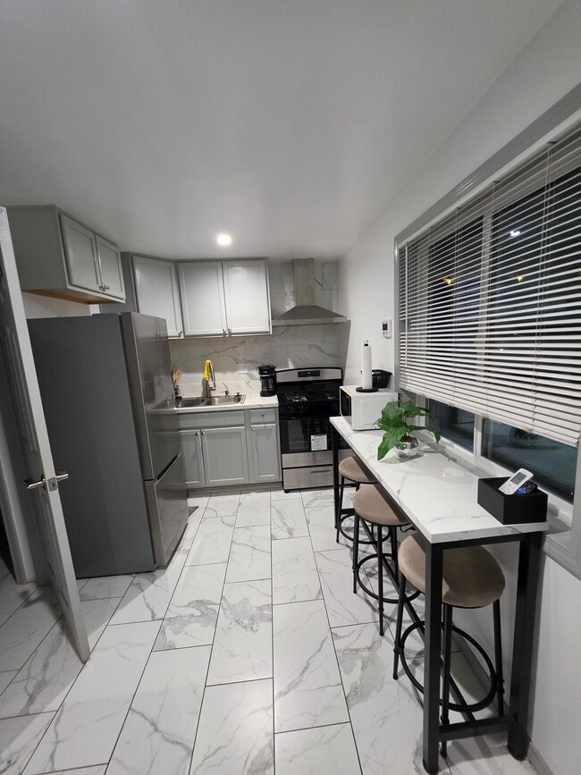 Kitchen/ living room - 124 E 135th St Unit Back