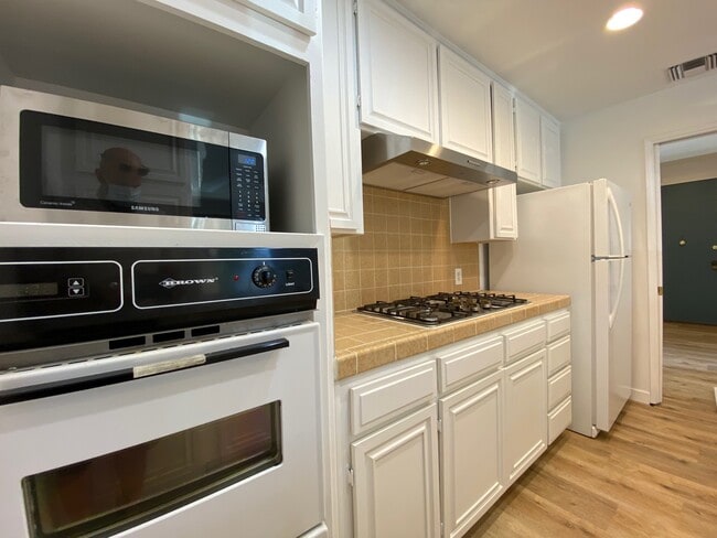 Kitchen with some new appliances - 104 S Hayworth Ave Unit 106