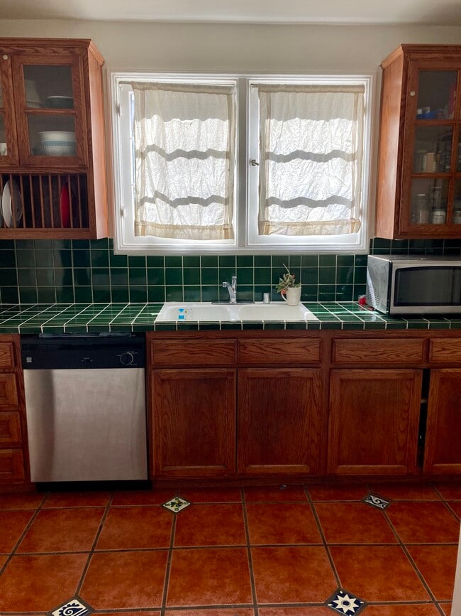 Wood enclosed cabinets in kitchen - 2423 St George St Unit 2423