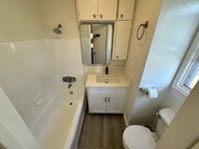 Photo - Located on a large lot, along with only four other cottage units, sits this 2 bedroom 1 bath unit