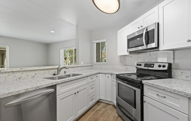 Building Photo - Remodeled Upper-Level 1BR Condo with Balcony & Garage Parking in Verano Community Unit 312