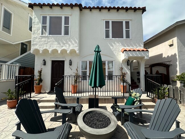 Private patio with fire pit on the sunny side of the court. - 726 Cohasset Ct