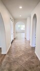 Hallway to Bedroom 1, Kitchen, & Family Room - 4317 Palazzo Ln House