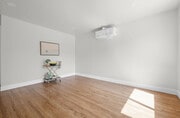 Living room with new paint, flooring, ac/heat - 9211 Earl St House