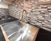 Sink and Stove - 1002 Mission Dr Apartments Unit D