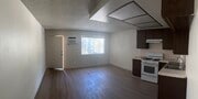 Front door, living room and kitchen - 200 S Carondelet St Unit Apt 2